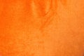 Orange shiny velvet texture background