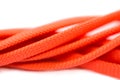 Orange shoelaces, isolated on a white background, macro Royalty Free Stock Photo