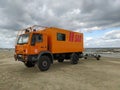 Orange shore rescue service Polish truck on a shore