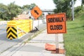 orange sidewalk closed sign on sidewalk with construction and orange sign. ph Royalty Free Stock Photo