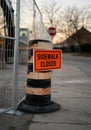 Sidewalk closed orange sign on traffic cone