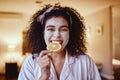 Orange, skincare and portrait of woman eating in bedroom for wellness, grooming or facial. Fruit, face and girl relax Royalty Free Stock Photo