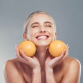 Orange, skincare and woman in studio with fruit for a natural beauty facial cosmetics product with mockup space. Smile Royalty Free Stock Photo