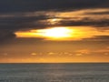 Orange sky, dark clouds, sunset from a ship on the Atlantic Ocean Royalty Free Stock Photo