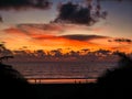 An orange sky over clouds at sunset at Bentota beach in southern Sri Lanka Royalty Free Stock Photo