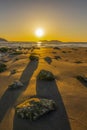 Orange sky over a rocky seashore. Sunset landscape. Royalty Free Stock Photo