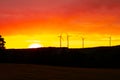 Wind Turbines in a orange sunset Royalty Free Stock Photo