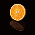 Orange slice isolated on a black Royalty Free Stock Photo