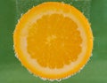 Orange Slice Submerged With Bubbles