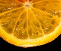 An orange, sliced and dripping with juice, indicates juiciness. Orange juice dripping from orange fruit. studio shot fruit with