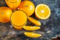 Orange sliced and orange juice glasses with green leaf on wooden table Royalty Free Stock Photo