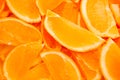 Orange slices arranged in seamless pattern on yellow and orange background Royalty Free Stock Photo
