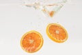 Orange slices bubbling in water Royalty Free Stock Photo