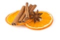 Orange slices, cinnamon and anise on white