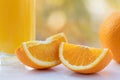 Orange slices closeup on white table against blurred background. Healthy fruits Royalty Free Stock Photo