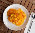 Orange slices drizzled with honey and sprinkled with corn flakes on plate