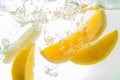 Orange Slices falling deeply under water with a big splash Royalty Free Stock Photo