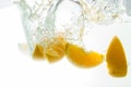 Orange Slices falling deeply under water with a big splash Royalty Free Stock Photo