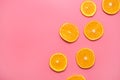 Orange slices on a pink background. fresh orange slices fruit pattern on pink background Royalty Free Stock Photo