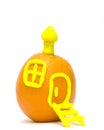 An orange - a small house Royalty Free Stock Photo