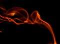 Orange smoke on black background Royalty Free Stock Photo