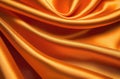 orange smooth silk fabric or satin with pleats and waves creased soft drapery material