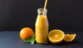 Orange smoothie in glass bottle with paper straw. Tasty and healthy drink. Summer beverage Royalty Free Stock Photo