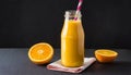 Orange smoothie in glass bottle with paper straw. Tasty and healthy drink. Summer beverage Royalty Free Stock Photo