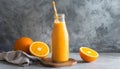 Orange smoothie in glass bottle with paper straw. Tasty and healthy drink. Summer beverage Royalty Free Stock Photo