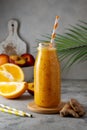 Orange smoothie made with peach, ginger and orange, healthy drink. Royalty Free Stock Photo