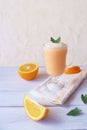 Orange smoothie, milkshake with orange and mint