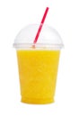 Orange smoothie in plastic cup Royalty Free Stock Photo