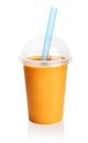 Orange smoothie in plastic transparent cup Royalty Free Stock Photo