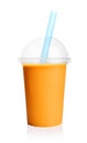 Orange smoothie in plastic transparent cup Royalty Free Stock Photo