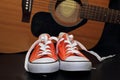 Orange sneakers and guitar Royalty Free Stock Photo