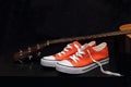 Orange sneakers and guitar Royalty Free Stock Photo