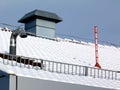 Red snow depth measuring stick and galvanized sheet steel mechanical duct Royalty Free Stock Photo