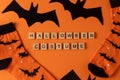 Orange socks with bats. Clothing costume for Halloween party. Cheerful bright multicolored sock top view.