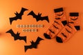 Orange socks with bats. Clothing costume for Halloween party. Cheerful bright multicolored sock top view.