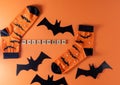 Orange socks with bats. Clothing costume for Halloween party. Cheerful bright multicolored sock top view.