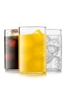 Orange soft drink with cola and lemonade soda with ice cubes on white background Royalty Free Stock Photo