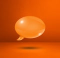 Orange speech bubble on concrete wall square background Royalty Free Stock Photo