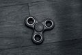 A orange spinner on floor. With dark black background. Royalty Free Stock Photo