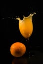 Orange with a splash Royalty Free Stock Photo