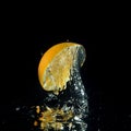 Orange splashing out of water Royalty Free Stock Photo