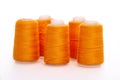 Orange spool of thread isolated on white background. Skein of woolen threads. Yarn for knitting. Materials for sewing Royalty Free Stock Photo