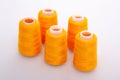 Orange spool of thread isolated on white background. Skein of woolen threads. Yarn for knitting. Materials for sewing Royalty Free Stock Photo