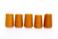 Orange spool of thread isolated on white background. Skein of woolen threads. Yarn for knitting. Materials for sewing Royalty Free Stock Photo