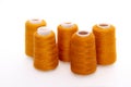 Orange spool of thread isolated on white background. Skein of woolen threads. Yarn for knitting. Materials for sewing Royalty Free Stock Photo
