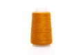 Orange spool of thread isolated on white background. Skein of woolen threads. Yarn for knitting. Materials for sewing Royalty Free Stock Photo